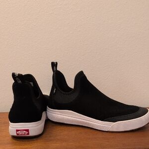 Vans Black and White Slip-On Sneakers